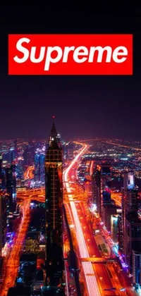 This phone live wallpaper displays a stunning view of a city at night, captured from the top of a magnificent skyscraper