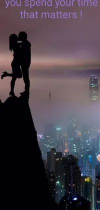 This live phone wallpaper features a romantic mountain kiss scene with a Hong Kong cityscape background