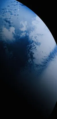 Experience a stunning live wallpaper depicting the breathtaking view of Planet Earth from a space station, accompanied by an exotic ocean on an alien planet known as Titan