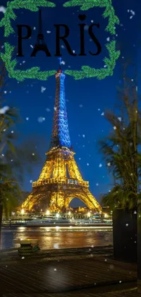 This phone wallpaper portrays the Eiffel tower lit up against the night sky