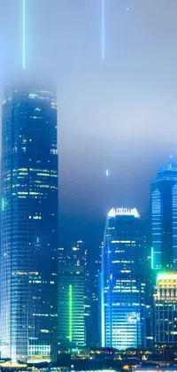 This striking live wallpaper features a modern cityscape backdrop, with a skyscraper standing tall behind a shimmering body of water