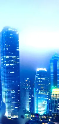 This live wallpaper features a stunning cityscape view of a metropolis at night with buildings reflecting on calm waters