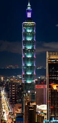 This live wallpaper captures the spectacular beauty of a tall building illuminated against the night sky in Taiwan