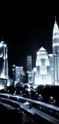 Enhance your phone display with a captivating live wallpaper of a black and white city at night