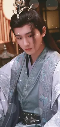 This phone live wallpaper features a stunning close-up of a male figure wearing a grey robe and crown, inspired by xianxia and shin hanga genre