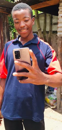 This live wallpaper features a man wearing a blue shirt holding a smartphone