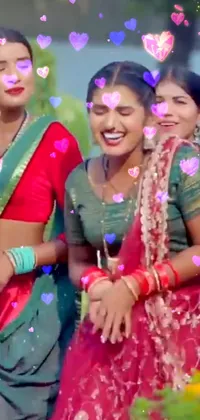 This lively phone live wallpaper features a group of smiling and dancing women, wearing colorful clothing and traditional tribal jewelry