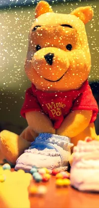 This delightful live wallpaper features Winnie the Pooh, the iconic beloved stuffed animal, sitting on a table