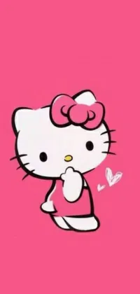 This adorable live wallpaper features Hello Kitty on a pink background, striking a fighting pose