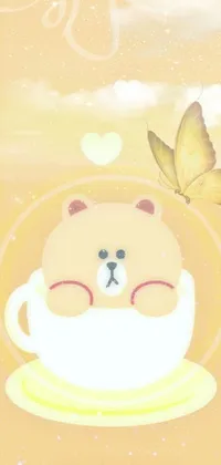 This phone live wallpaper features an adorable teddy bear sitting in a steaming hot cup of coffee, surrounded by delicate butterflies
