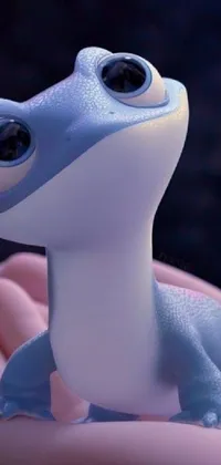 This phone live wallpaper showcases a toy lizard perched on a hand - a charming close-up image brought to life by the Pixar team