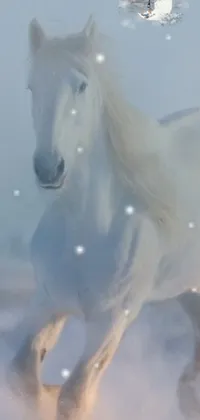 This mobile wallpaper showcases a beautiful white horse running through a snow-covered field accompanied by swirling snowflakes and twinkling stars in the background