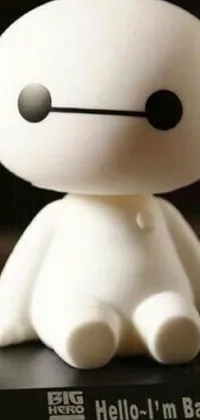Get ready to brighten up your phone screen with this delightful Baymax Live Wallpaper featuring a white toy statue