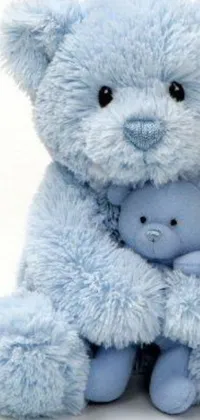 This live wallpaper features a lovely blue teddy bear cuddling a small baby