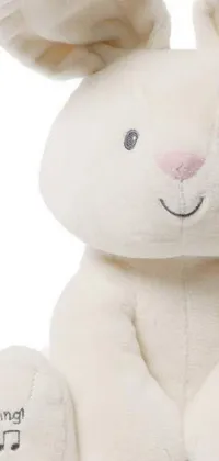 Discover an enchanting live wallpaper featuring a close-up view of a cute stuffed animal on a white background