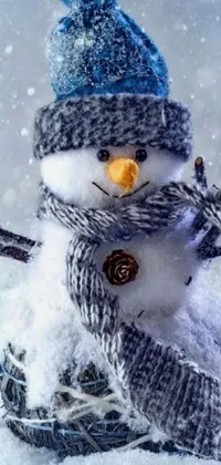 Add a festive touch to your phone with this cute snowman live wallpaper