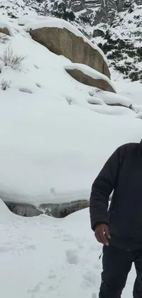 This exhilarating phone live wallpaper displays a man skiing down a snow-covered slope, with a huge smile on his face and arms raised in excitement
