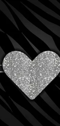 Add a touch of glam to your phone with this lively zebra print phone live wallpaper! Designed with a glittery silver heart as the centerpiece, this black and silver wallpaper is perfect as a website avatar or phone background