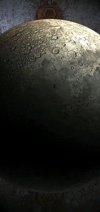 This phone live wallpaper features the stunning close-up of a moon with a sophisticated clock in the background