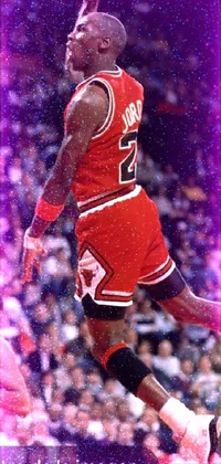 This stunning live wallpaper depicts a basketball player in mid-air, dribbling the ball while wearing a striking black and red suit