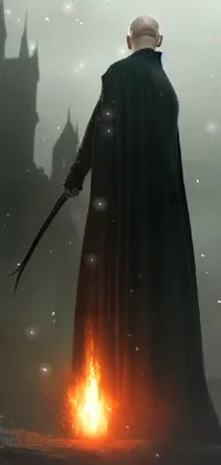 This live wallpaper for phones depicts a man wielding a sword in front of a castle, with a flaming grim reaper in the background