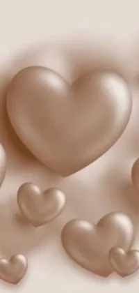 This phone live wallpaper features heart designs in a brown to silver gradient, with a three-dimensional and satin texture, creating a romantic and elegant appearance