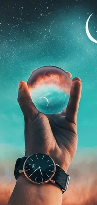 Bring a touch of mysticism to your phone with this mesmerizing live wallpaper! Featuring a hyper-realistic painting of a person holding a transparent glass ball against a beautiful crescent moon and starry sky backdrop, this wallpaper is visually stunning