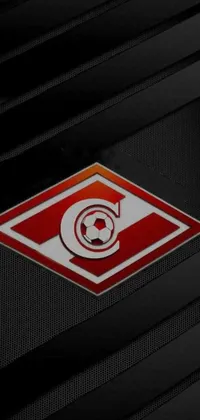 This live wallpaper features a soccer team logo on a black background with red pennants and a red eye