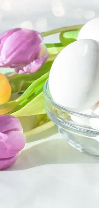 This charming live wallpaper features a delightful glass bowl filled with eggs and tulips