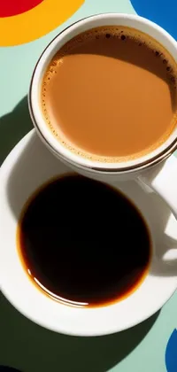 Get mesmerized by the stunning live wallpaper featuring a cup of coffee on a saucer with a yin yang balance