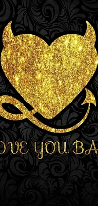 This stunning phone live wallpaper features a captivating gold heart with horns set against a dramatic black background