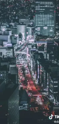 This phone live wallpaper depicts a vibrant, digitally-rendered aerial view of a bustling city at night