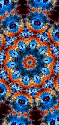 Looking for a mesmerizing phone live wallpaper with a vibrant tie dye pattern? Check out this digital rendering on Flickr by Jon Coffelt! The blue and orange mandala ornament has a flowercore vibe and features repeating patterns of coral-like gemstones