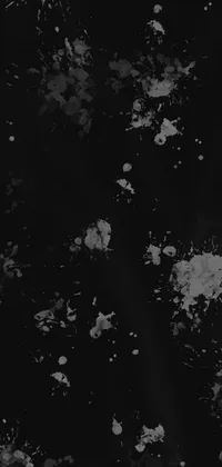 This phone live wallpaper showcases an abstract design of black and white paint splatters, sourced from DeviantArt