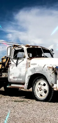 This live wallpaper features a rustic truck parked on dirt terrain amidst an oil rig in Utah