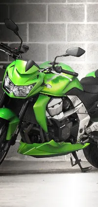 This dynamic phone live wallpaper showcases a vivid green motorcycle parked against a textured brick backdrop