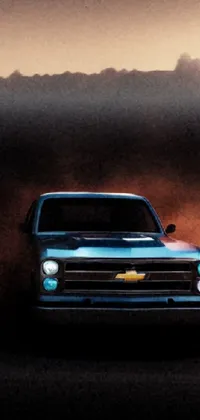 This live phone wallpaper features a digital artwork of a blue pickup truck driving down a dirt road
