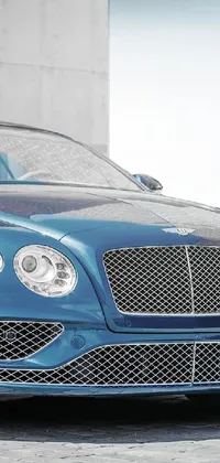 Looking for a sleek live wallpaper to add to your phone's sophistication and elegance? Look no further than this exquisite digital rendering, featuring a luxurious blue Bentley parked in front of a chic building