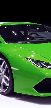 This phone live wallpaper features a sleek green sports car set against a white background
