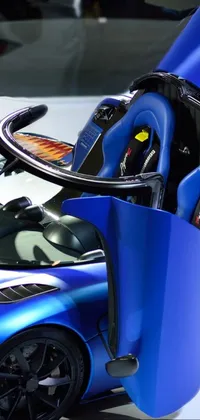 Get ready to rev up your phone's screen with this live wallpaper featuring a dynamic blue sports car with its doors flung open