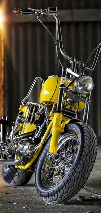 This phone wallpaper features a hyper-realistic 3D render of a yellow motorcycle parked in a garage