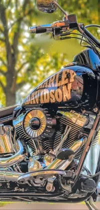 This is a stunning live wallpaper for your phone, featuring a close up view of a Harley Davidson motorbike parked on a street