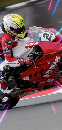 This phone live wallpaper showcases a thrilling motorcycle race on a track