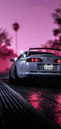 Toyota supra mk4 driving through the streets of japan at night on