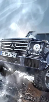 Looking for an exciting and powerful live wallpaper for your phone? Check out this amazing black SUV live wallpaper! Featuring a sleek and stylish Mercedez Benz SUV parked on a rugged rocky hill, this image showcases the full capability and prowess of this dynamic vehicle
