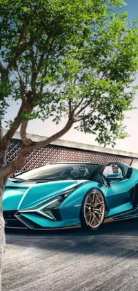 Looking for a dynamic and visually stunning phone live wallpaper? Look no further than this blue sports car driving on a racetrack! This colorized photo features a sleek and stylish design, reminiscent of popular supercars like the Lamborghini Veneno