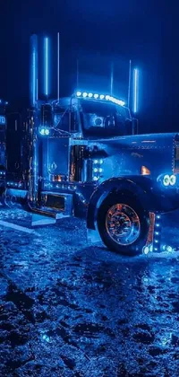 This stunning live phone wallpaper features two parked semi trucks in a blue LED-lit background