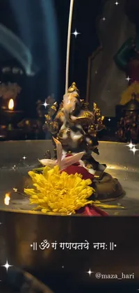 This captivating live wallpaper features a stunning small statue seated atop a table accompanied by beautiful lotus flowers