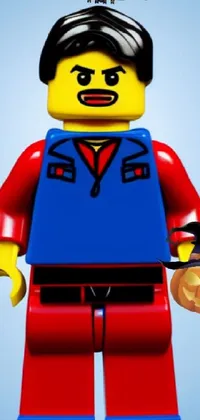 This live wallpaper features a charming lego man holding a pumpkin and examining a glowing red crystal