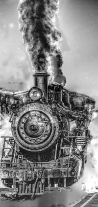 This live wallpaper displays a black and white portrait of a steam engine train, surrounded by smoke and steam